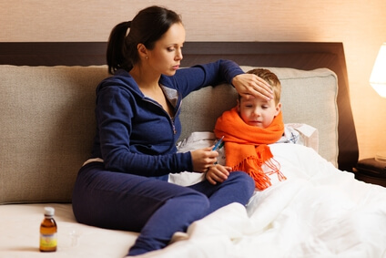 _young-mother-and-her-sick-son-in-a-bed