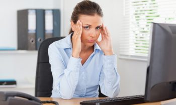 businesswoman-with glandular fever and headaches looking-into-the-camera_size