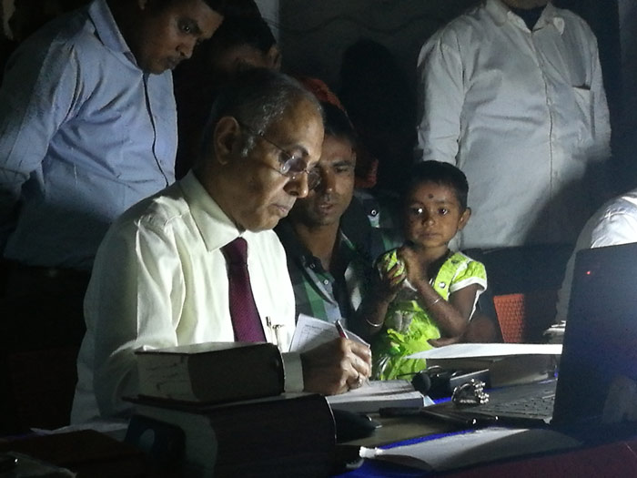 Using homeopathy in India in the Calcutta Slum Project clinic proceeds into the night and with frequent power cuts.