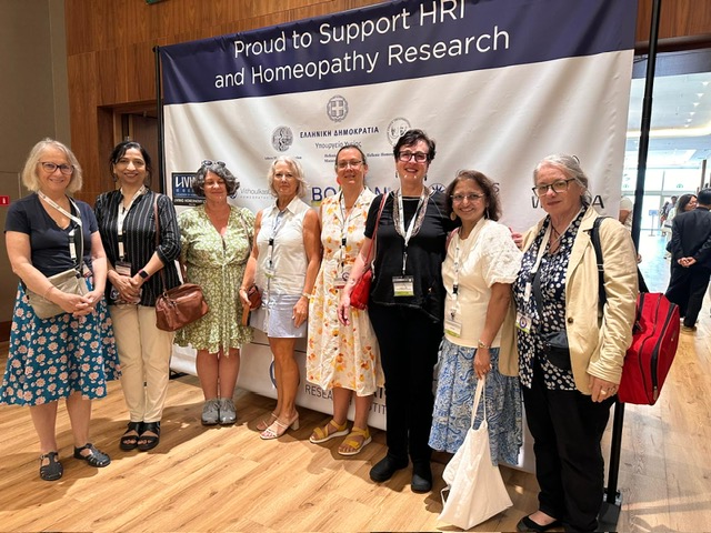 Aurum Project members at HRI conference 2025 Greece. From left to right:Linlee Jordan (AP Director), Dr Sujata Naik (Clinic Director), Sandra Venables (Australian Register of Homoeopaths), Jane Lindsay (AP Vice President), Barbara Roberts (NZ Homeopath), Virginia Turner (Australian Homoeopathic Association), Dr Niri Pandit (AP Assistant Vice President), Lee Formica (Homeopath)